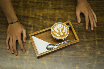 High angle view of coffee cup on table