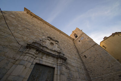 Low angle view of old building against sky