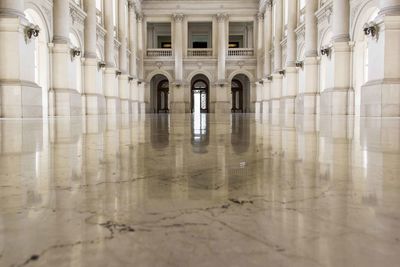 Symmetrical view of corridor of a historical building