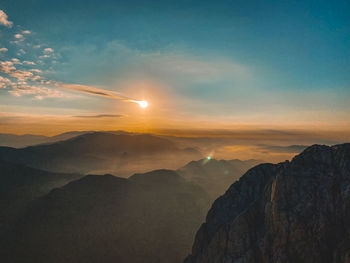 Scenic view of mountains against sky during sunset