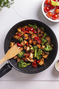 Teriyaki chicken with vegetables on a frying pan