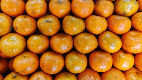 Full frame shot of oranges at market stall