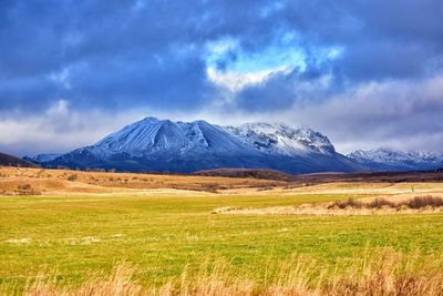 Scenic view of landscape and mountains against sky