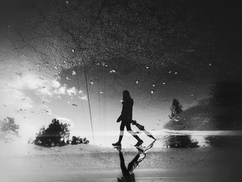 Reflection of woman in water