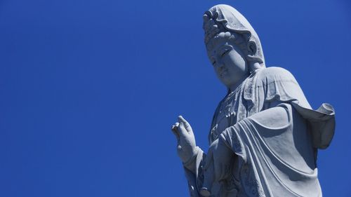 Low angle view of guanyin bodhisattva statue at nan hai pu tuo temple