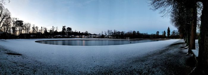 Scenic view of frozen lake against sky