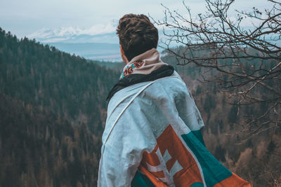 Side view of man standing on land