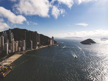 Panoramic view of sea and buildings against sky