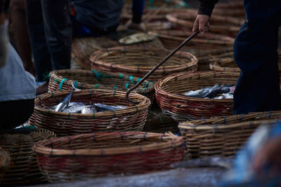 Buckets of fresh sardines fish at traditional seafood market, indonesia