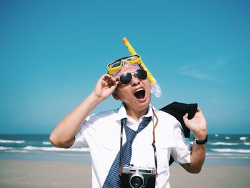 Man wearing scuba mask at beach