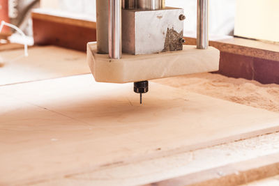 Close-up of machine part on table at home