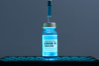 Close-up of information sign against blue background