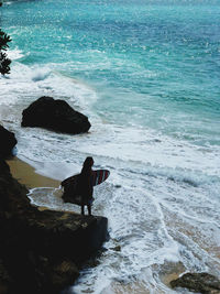 Man looking at sea shore