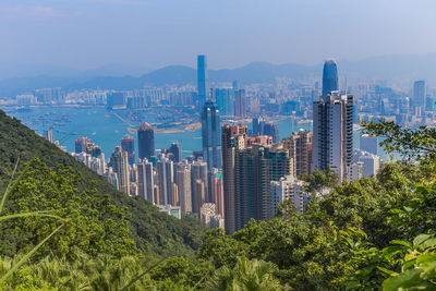 Panoramic view of buildings in city against sky