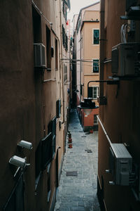 Narrow alley amidst buildings in city