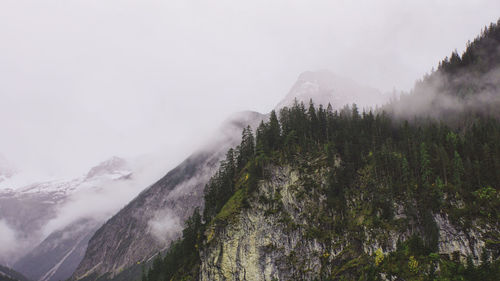 Scenic view of mountains against sky during winter