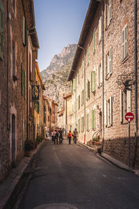 Street amidst buildings against sky