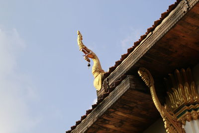 Low angle view of statue against sky