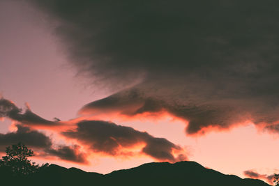 Low angle view of dramatic sky during sunset