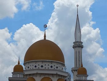 Low angle view of mosque against sky