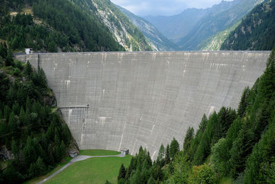 Scenic view of dam and trees on mountain