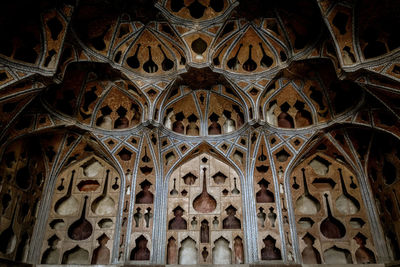 Low angle view of ornate ceiling of building