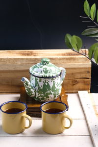 Hot tea on vintage enamel teapot.