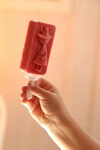 Close-up of cropped hand holding ice cream