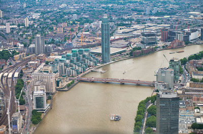 High angle view of bridge over river and buildings in city