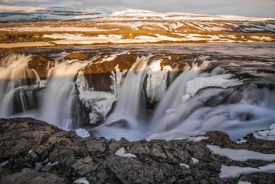 Scenic view of waterfall during winter