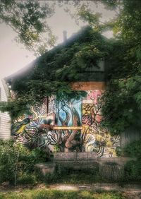 Statue against trees