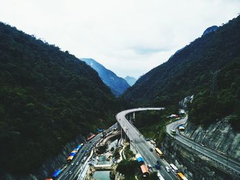 High angle view of bridge and mountains against sky