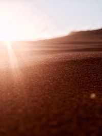 Scenic view of desert against sky during sunset