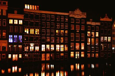 Building with illuminated apartment building