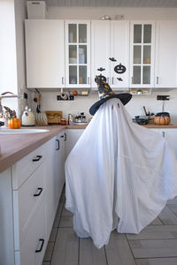 Portrait of woman standing at home