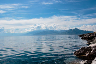 Scenic view of sea against cloudy sky