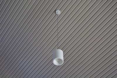 Low angle view of light bulbs on wall