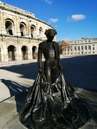 Statue of woman in city