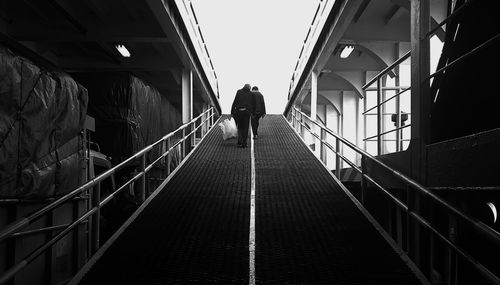 Old man walking on the bridge of the ship