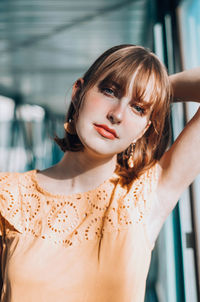 Portrait of beautiful young woman standing outdoors