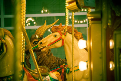 View of carousel horse in amusement park