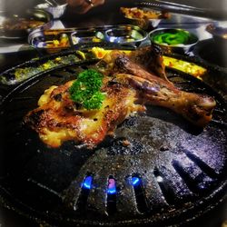 Close-up of meat on barbecue grill