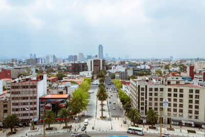 High angle view of buildings in city against sky