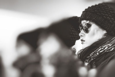 Close-up portrait of a young woman looking away