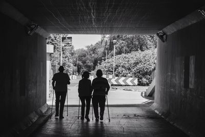 Men walking in corridor