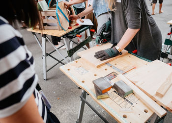 High angle view of people working on table