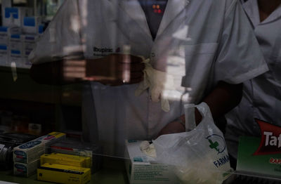 Rear view of people standing at home