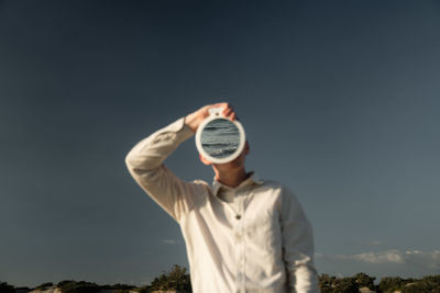 Full length of man standing against sky