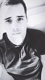 Portrait of young man at home