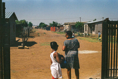 Rear view of father and son